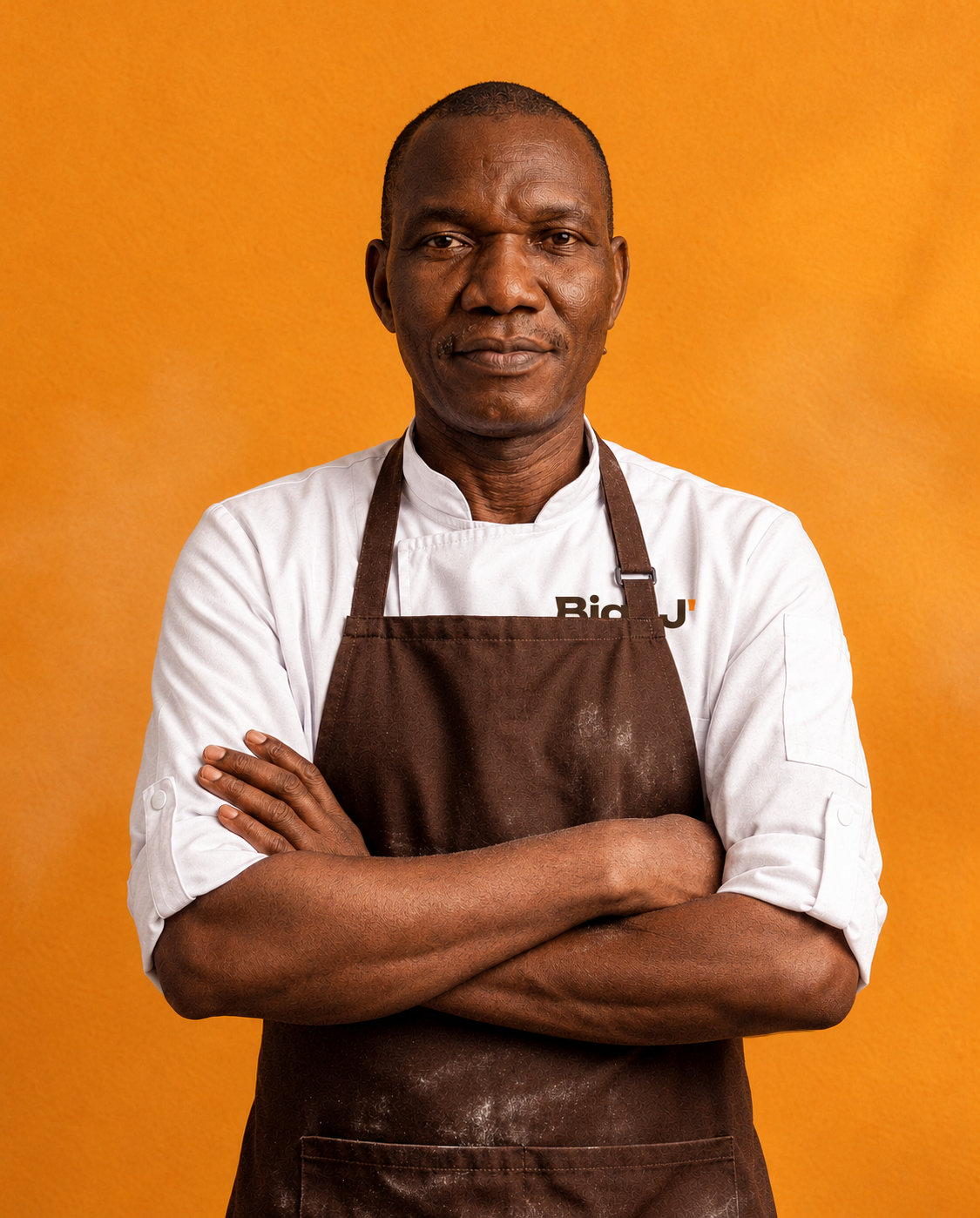 Mr Dele Obakemi, founder of Big J' Bakeries Consulting, in his Big J' chef jacket and baker's apron